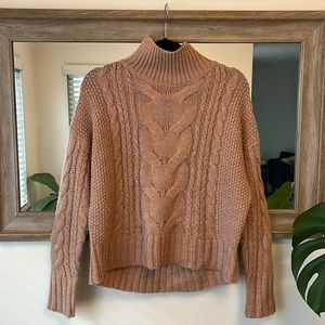 Turtleneck sweater from 360 Italian Yarn. Worn but in good condition.
